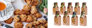 Auzu cepumi ar rozīnēm un dažādu garšu iepakojumi uz balta fona