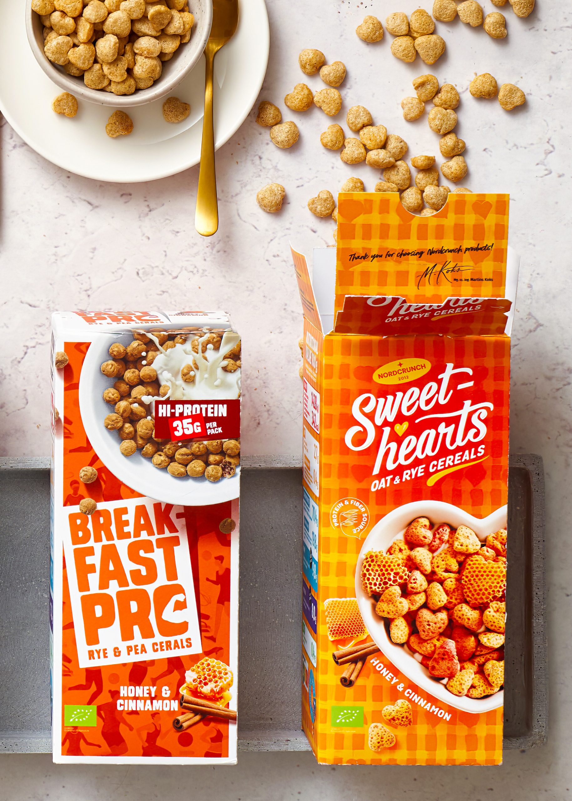 Nordcrunch brokastu pārslas – Breakfast Pro un Sweethearts iepakojumi ar medus un kanēļa garšu