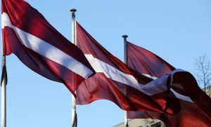 Latvijas karogi plīvo vējā valsts svētku noskaņā.