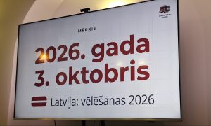 Ekrānā redzams paziņojums par 2026. gada 3. oktobra vēlēšanām Latvijā